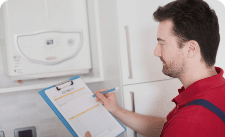 About Us — HVAC technician inspecting equipment