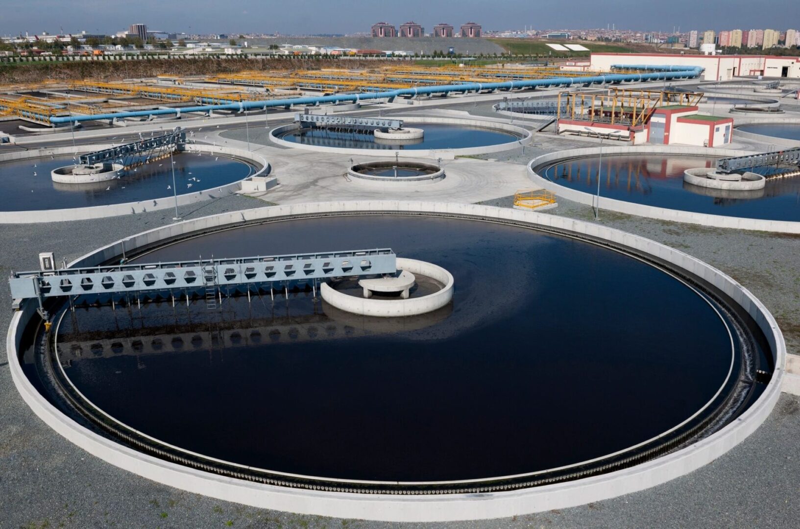 A large water plant with many reservoirs and a lot of water.