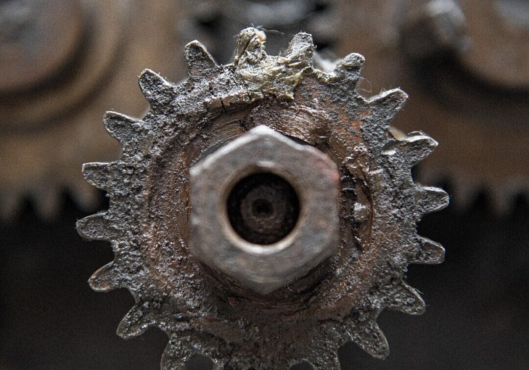 A close up of an old gear wheel